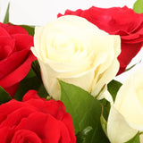 Birthday Balloon & 12 Red & White Roses FlowersThis Beautiful Bouquet, carefully selected flowers with foliage are expertly arranged to create this dramatic design. This stunning gift is the ultimate gift to create an impression. Beautifully wrapped and t