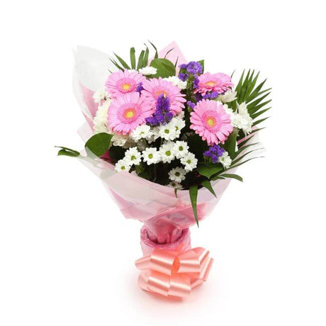 Serenity BouquetThis Beautiful Bouquet, carefully selected flowers with foliage are expertly arranged to create this dramatic design. This stunning gift is the ultimate gift to create an impression. Beautifully wrapped and tied with ribbon before being de