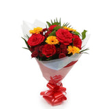 Red Sun BouquetThis Beautiful Bouquet, carefully selected flowers with foliage are expertly arranged to create this dramatic design. This stunning gift is the ultimate gift to create an impression. Beautifully wrapped and tied with ribbon before being del