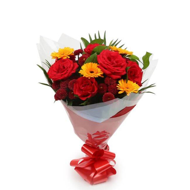 Red Sun BouquetThis Beautiful Bouquet, carefully selected flowers with foliage are expertly arranged to create this dramatic design. This stunning gift is the ultimate gift to create an impression. Beautifully wrapped and tied with ribbon before being del