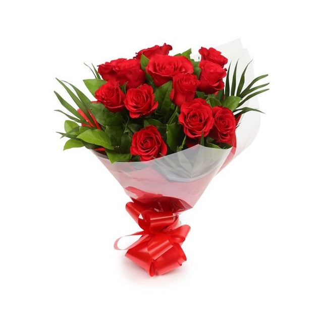 12 Red RosesThis Beautiful Bouquet, carefully selected flowers with foliage are expertly arranged to create this dramatic design. This stunning gift is the ultimate gift to create an impression. Beautifully wrapped and tied with ribbon before being delive