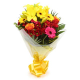Warm Sunset BouquetThis Beautiful Bouquet, carefully selected flowers with foliage are expertly arranged to create this dramatic design. This stunning gift is the ultimate gift to create an impression. Beautifully wrapped and tied with ribbon before being