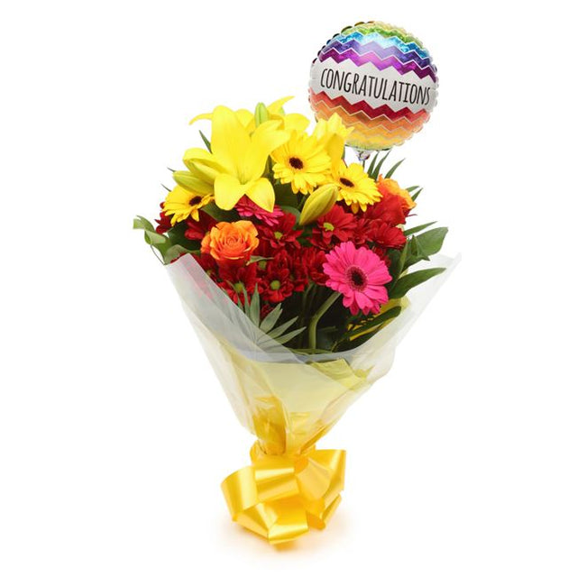 Congratulations Balloon & Warm Sunset FlowersThis Beautiful Bouquet, carefully selected flowers with foliage are expertly arranged to create this dramatic design. This stunning gift is the ultimate gift to create an impression. Beautifully wrapped and tie