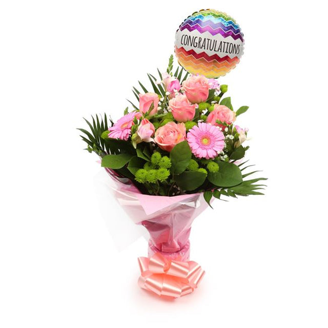 Congratulations Balloon & Cherished Pink FlowersThis Beautiful Bouquet, carefully selected flowers with foliage are expertly arranged to create this dramatic design. This stunning gift is the ultimate gift to create an impression. Beautifully wrapped and