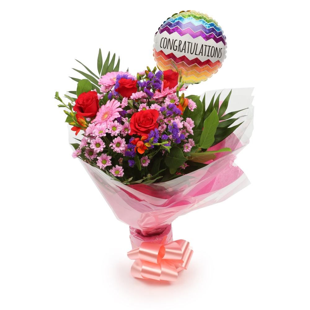Congratulations Balloon & Red Blush FlowersThis Beautiful Bouquet with Balloon, carefully selected flowers with foliage are expertly arranged to create this dramatic design. This stunning gift is the ultimate gift to create an impression. Beautifully wrap