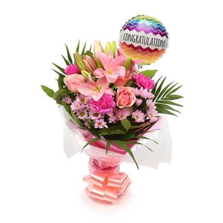 Congratulations Balloon & Pink Candy FlowersThis Beautiful Bouquet with Balloon, carefully selected flowers with foliage are expertly arranged to create this dramatic design. This stunning gift is the ultimate gift to create an impression. Beautifully wra