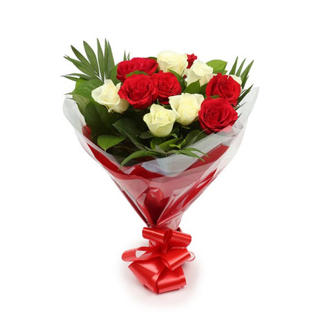 Birthday Balloon & 12 Red & White Roses FlowersThis Beautiful Bouquet, carefully selected flowers with foliage are expertly arranged to create this dramatic design. This stunning gift is the ultimate gift to create an impression. Beautifully wrapped and t