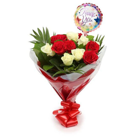Thank You Balloon & 12 Red & White RosesThis Beautiful Bouquet, carefully selected flowers with foliage are expertly arranged to create this dramatic design. This stunning gift is the ultimate gift to create an impression. Beautifully wrapped and tied wit