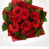 Luxury Red BouquetCreate a lasting impression with this dazzling hand-tied bouquet. We've selected Red Germini and Red Roses, a luminous gift which is guaranteed to make someone smile. Beautifully wrapped and tied with ribbon before being delivered.£14.99