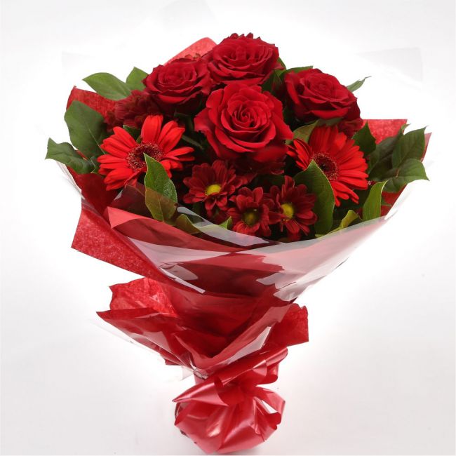 Luxury Red BouquetCreate a lasting impression with this dazzling hand-tied bouquet. We've selected Red Germini and Red Roses, a luminous gift which is guaranteed to make someone smile. Beautifully wrapped and tied with ribbon before being delivered.£14.99