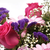 Pink Classic BouquetAn endearing classic in soft Pink with deep pink accents. Exquisite large headed Roses are complemented by Palm & delicate Pink Gypsophila, luxurious green foliage Pink Statice, to create a sophisticated hand-tied bouquet certain to im