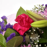 Pink Classic BouquetAn endearing classic in soft Pink with deep pink accents. Exquisite large headed Roses are complemented by Palm & delicate Pink Gypsophila, luxurious green foliage Pink Statice, to create a sophisticated hand-tied bouquet certain to im