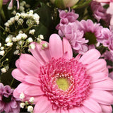 Pink Classic BouquetAn endearing classic in soft Pink with deep pink accents. Exquisite large headed Roses are complemented by Palm & delicate Pink Gypsophila, luxurious green foliage Pink Statice, to create a sophisticated hand-tied bouquet certain to im