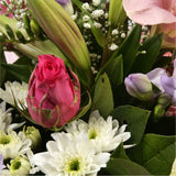 Pink Radiance BouquetAn endearing classic Lilies in soft pinks and whites with purple Freesias, large exquisite headed Anastasias, Pink Roses are complemented by delicate pink Gypsophila, luxurious sophisticated hand-tied bouquet certain to impress. Beaut