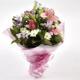 Pink Radiance BouquetAn endearing classic Lilies in soft pinks and whites with purple Freesias, large exquisite headed Anastasias, Pink Roses are complemented by delicate pink Gypsophila, luxurious sophisticated hand-tied bouquet certain to impress. Beaut