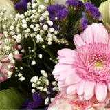 Pink Summer ChickThis Sweet Pink bouquet features matching pink Gerberas, Pink White Carnations, purple Statice and Pink Gypsophila, punctuated with White Roses. Expertly created by our florists Beautifully wrapped and tied with ribbon before being delive