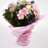 Pink Summer ChickThis Sweet Pink bouquet features matching pink Gerberas, Pink White Carnations, purple Statice and Pink Gypsophila, punctuated with White Roses. Expertly created by our florists Beautifully wrapped and tied with ribbon before being delive