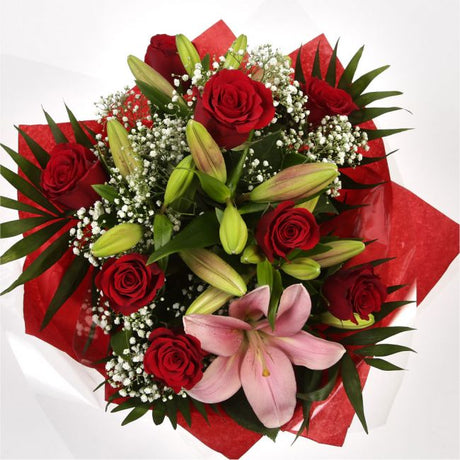 Special Rose and Lily BouquetSpecial Rose and Lily Bouquet Red Roses, Oriental Lilies and Palm foliage are expertly arranged to create this dramatic design. This stunning gift is the ultimate gift to create an impression. Beautifully wrapped and tied with