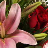Special Rose and Lily BouquetSpecial Rose and Lily Bouquet Red Roses, Oriental Lilies and Palm foliage are expertly arranged to create this dramatic design. This stunning gift is the ultimate gift to create an impression. Beautifully wrapped and tied with