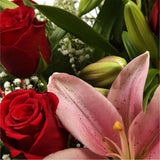 Special Rose and Lily BouquetSpecial Rose and Lily Bouquet Red Roses, Oriental Lilies and Palm foliage are expertly arranged to create this dramatic design. This stunning gift is the ultimate gift to create an impression. Beautifully wrapped and tied with
