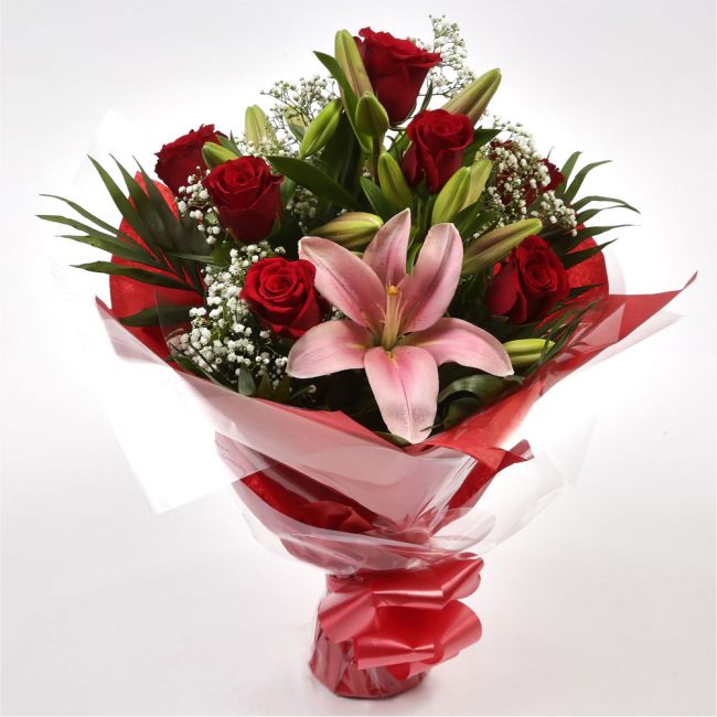 Special Rose and Lily BouquetSpecial Rose and Lily Bouquet Red Roses, Oriental Lilies and Palm foliage are expertly arranged to create this dramatic design. This stunning gift is the ultimate gift to create an impression. Beautifully wrapped and tied with