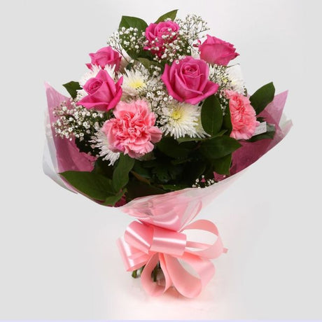Strawberry PinkStrawberry Pink Blush Bouquet, Pink Roses & Gypsophila and carefully selected flowers with foliage are expertly arranged to create this dramatic design. This stunning gift is the ultimate gift to create an impression. Beautifully wrapped an