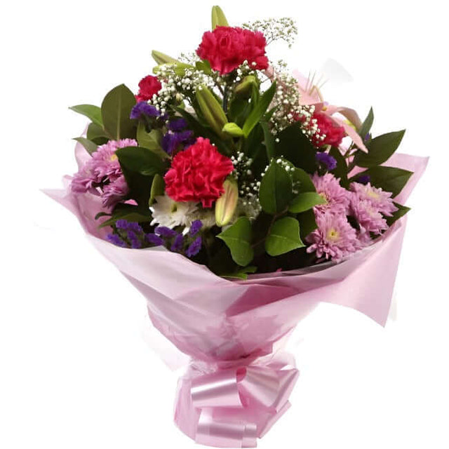 Stunning Pink Cerise BouquetThis Sweet Pink bouquet features matching Pink Chrysanthemums, Pink Cerise Carnations, purple Statice and Gypsophila, punctuated with leaves Pink Lillies, expertly created by our florists. Beautifully wrapped and tied with ribb