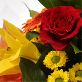 Orange Sunshine BouquetThis Sunshine bouquet features matching Red Roses.Orange Gerberas, Red Carnations, Lillie's with Solidago and other assorted flowers, punctuated with palm leaves expertly created by our florists.Beautifully wrapped and tied with rib