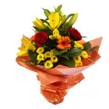 Orange Sunshine BouquetThis Sunshine bouquet features matching Red Roses.Orange Gerberas, Red Carnations, Lillie's with Solidago and other assorted flowers, punctuated with palm leaves expertly created by our florists.Beautifully wrapped and tied with rib