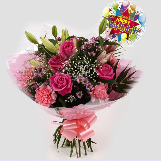 Birthday Balloon & Pink Crystal FlowersHappy Birthday Balloon & Beautiful Pink Crystal Bouquet, Pink Roses and Lillies with Gypsophila, Pink Dianthus, Pink Santini flowers and foliage, wrapped with matching ribbon. Beautifully wrapped and tied with ribbon