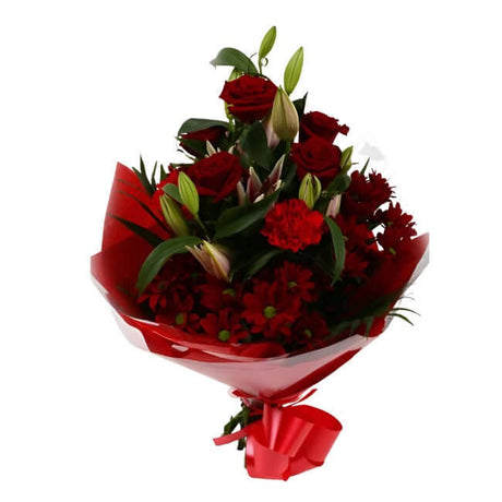 Red Roses & Lilly BouquetRed Roses & Lilly Bouquet, A beautiful Elegant bouquet featuring Red Roses, Pink Lillies, Red Chrysanthemums, Red Dianthus and Stylish Palm leaves with Foliage, perfect. Expertly created by our florists Beautifully wrapped and tie
