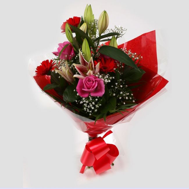 Pink Oriental BouquetPink Oriental Bouquet, Pink Roses, Oriental Lilies, Gypsophila with Red Germini and Palm foliage are expertly arranged to create this dramatic design. This stunning gift is the ultimate gift to create an impression.£14.99